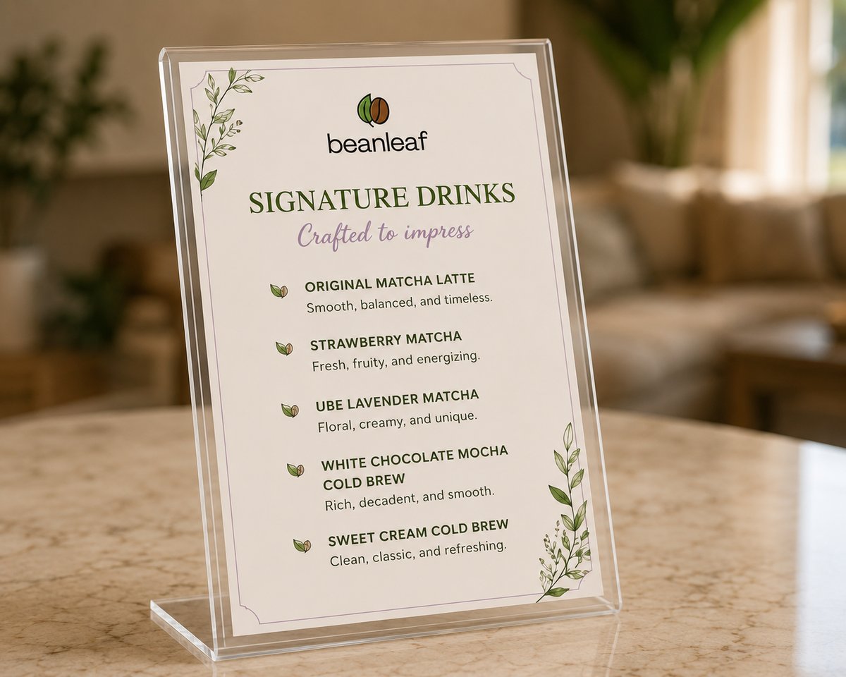 A Beanleaf signature drinks sign on a marble table in a styled living room